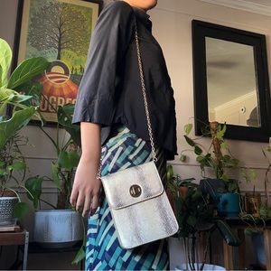 Gold crossbody purse with a chain strap